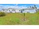 Spacious backyard with grassy area and privacy fence at 6308 Bayberry Ne Blvd, Winter Haven, FL 33881