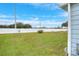 Large backyard with grassy area and white privacy fence at 6308 Bayberry Ne Blvd, Winter Haven, FL 33881