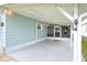 Covered patio area adjacent to the house, offering shade and extra space at 6308 Bayberry Ne Blvd, Winter Haven, FL 33881