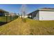Large backyard with grassy lawn and a privacy fence at 727 Annabell Ridge Rd, Minneola, FL 34715
