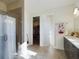 Bright bathroom with shower, closet, and double vanity at 727 Annabell Ridge Rd, Minneola, FL 34715