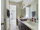 Modern bathroom with double sinks and shower at 727 Annabell Ridge Rd, Minneola, FL 34715
