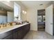 Elegant bathroom with double vanity and view of bedroom at 727 Annabell Ridge Rd, Minneola, FL 34715
