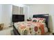 Spacious bedroom with patterned bedding and plenty of closet space at 727 Annabell Ridge Rd, Minneola, FL 34715
