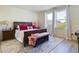 Spacious main bedroom with king-size bed and window view at 727 Annabell Ridge Rd, Minneola, FL 34715
