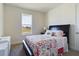 Bright bedroom featuring a comfortable bed and window view at 727 Annabell Ridge Rd, Minneola, FL 34715
