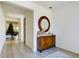 Elegant entryway, featuring a wood console table and a statement mirror at 727 Annabell Ridge Rd, Minneola, FL 34715