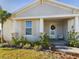 One-story house with light gray siding, white shutters, and a covered porch at 727 Annabell Ridge Rd, Minneola, FL 34715
