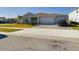 Beautiful home with a two-car garage and landscaped yard at 727 Annabell Ridge Rd, Minneola, FL 34715