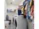Spacious laundry room with washer, dryer, and ample storage at 727 Annabell Ridge Rd, Minneola, FL 34715
