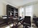 Spacious home office with built-in shelving and desk at 727 Annabell Ridge Rd, Minneola, FL 34715