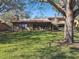 Large backyard with lush grass and mature oak tree at 111 Woden Way, Winter Haven, FL 33884