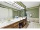 Bathroom boasts double vanity and shower at 111 Woden Way, Winter Haven, FL 33884
