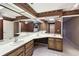 Double vanity bathroom with corner sink and large mirrors at 111 Woden Way, Winter Haven, FL 33884