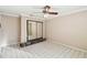 Spacious bedroom featuring mirrored closet doors and tile floors at 111 Woden Way, Winter Haven, FL 33884