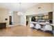 Bright dining area with hardwood floors and kitchen pass-through at 111 Woden Way, Winter Haven, FL 33884