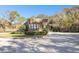 Gated community entrance with guard house at 111 Woden Way, Winter Haven, FL 33884