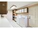 Laundry room with washer, dryer and storage at 111 Woden Way, Winter Haven, FL 33884