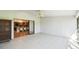 Screened porch with tile flooring and kitchen view at 111 Woden Way, Winter Haven, FL 33884