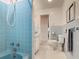 Light blue tiled bathroom with bathtub and toilet at 1117 N Lakeshore Blvd, Lake Wales, FL 33853