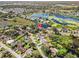 Aerial view showing home's location near lake at 1143 Waterview Pt, Lakeland, FL 33801