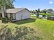 Spacious backyard with grassy area and water view at 1143 Waterview Pt, Lakeland, FL 33801