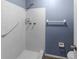 Shower stall with grab bar and white tile at 1143 Waterview Pt, Lakeland, FL 33801