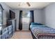 Bedroom with dresser, bed and window at 1143 Waterview Pt, Lakeland, FL 33801