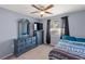 Bedroom with dresser, bed and window at 1143 Waterview Pt, Lakeland, FL 33801