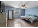 Main bedroom with a king-size bed and ensuite bathroom at 1143 Waterview Pt, Lakeland, FL 33801