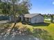 Ranch-style home with a two-car garage and a large backyard at 1143 Waterview Pt, Lakeland, FL 33801