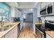 Modern kitchen with granite countertops and stainless steel appliances at 1143 Waterview Pt, Lakeland, FL 33801