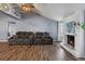 Living room with fireplace and recliner sofas at 1143 Waterview Pt, Lakeland, FL 33801