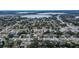 Wide aerial view of home, lake, and surrounding area at 115 7Th Jpv St, Winter Haven, FL 33880