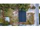 Aerial view showing house, yard, and shed at 115 7Th Jpv St, Winter Haven, FL 33880
