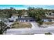 Aerial view of house and street in residential area at 115 7Th Jpv St, Winter Haven, FL 33880