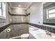 Modern bathroom with gray tile and a walk-in shower at 115 7Th Jpv St, Winter Haven, FL 33880