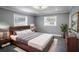 Main bedroom with a wooden bed frame and gray walls at 115 7Th Jpv St, Winter Haven, FL 33880