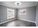 Bright bedroom with wood-look floors and large window at 115 7Th Jpv St, Winter Haven, FL 33880