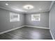 Empty bedroom with hardwood floors and neutral gray walls at 115 7Th Jpv St, Winter Haven, FL 33880