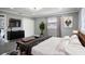 Main bedroom with king bed and modern dresser at 115 7Th Jpv St, Winter Haven, FL 33880