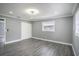 Spacious bedroom with wood-look floors and window at 115 7Th Jpv St, Winter Haven, FL 33880