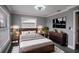 Bedroom with a wooden bed frame and gray walls at 115 7Th Jpv St, Winter Haven, FL 33880