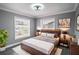 Bedroom with a wooden bed frame and gray walls at 115 7Th Jpv St, Winter Haven, FL 33880