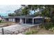 Newly renovated home with gray brick and a carport at 115 7Th Jpv St, Winter Haven, FL 33880