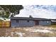 Gray house with red door, backyard view at 115 7Th Jpv St, Winter Haven, FL 33880