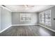 Empty living room with hardwood floors and neutral gray walls at 115 7Th Jpv St, Winter Haven, FL 33880