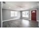 Spacious living room with hardwood floors and large windows at 115 7Th Jpv St, Winter Haven, FL 33880