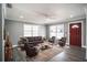 Living room featuring dark brown leather furniture and hardwood floors at 115 7Th Jpv St, Winter Haven, FL 33880