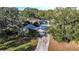 Aerial view of house with driveway and large trees at 1329 Mount Pisgah Rd, Fort Meade, FL 33841